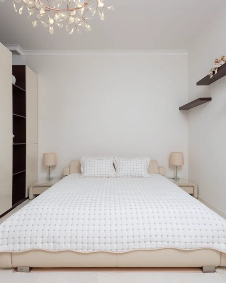 Narrow bedroom shelving on a slim wall strip