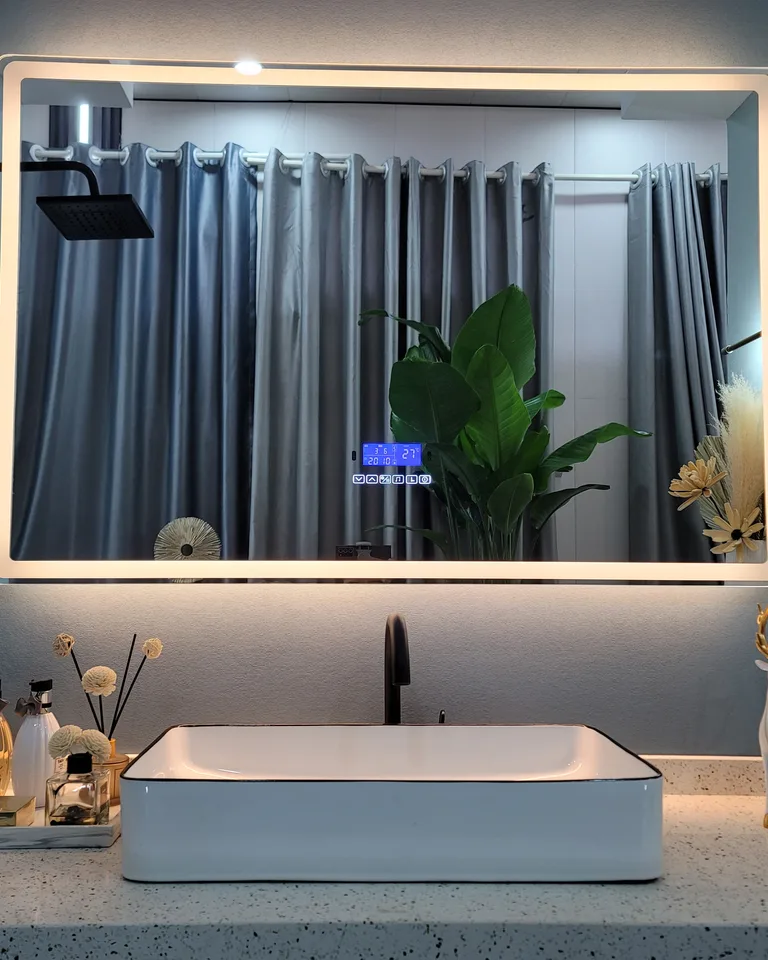 Frameless LED-lit bathroom mirror with soft halo glow