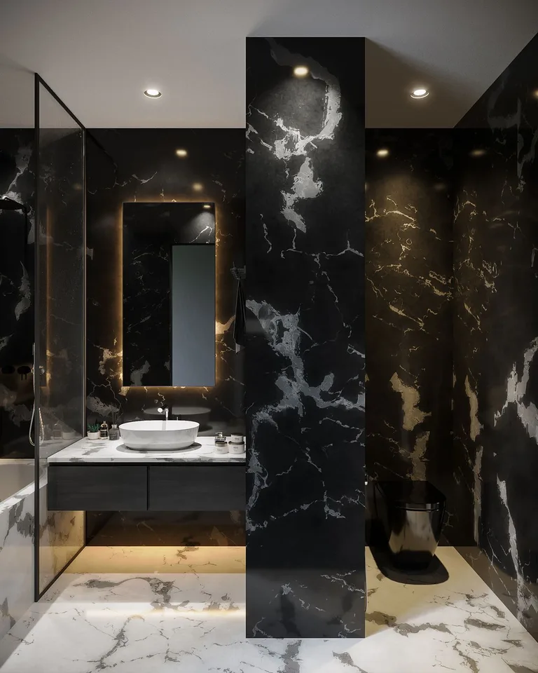 Dramatic black marble bathroom with tall dark columns and a floating vanity