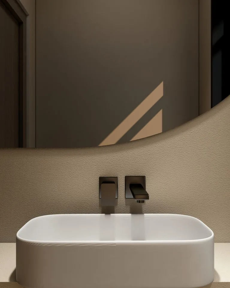 Neutral bathroom interior with a modern vessel sink and elegant faucet