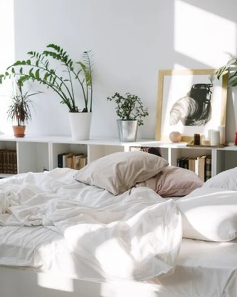 French country bedroom with layered white linen bedding and rustic wood furniture