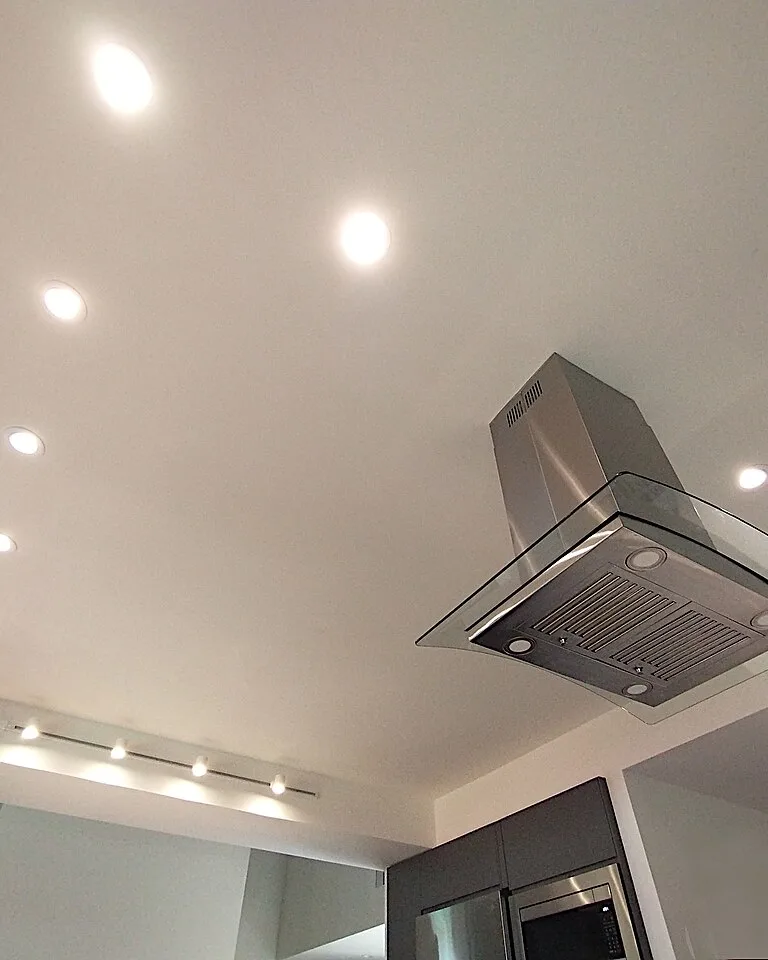 Under-cabinet LED lighting brightening a kitchen workspace