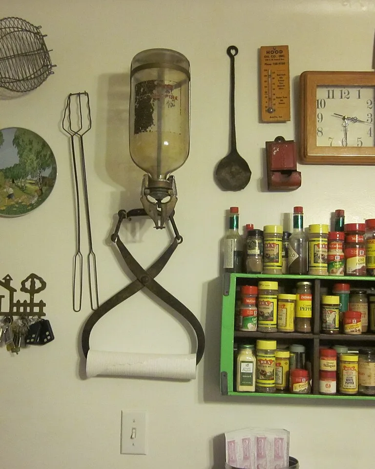 Organized kitchen wall with spice rack and tidy storage