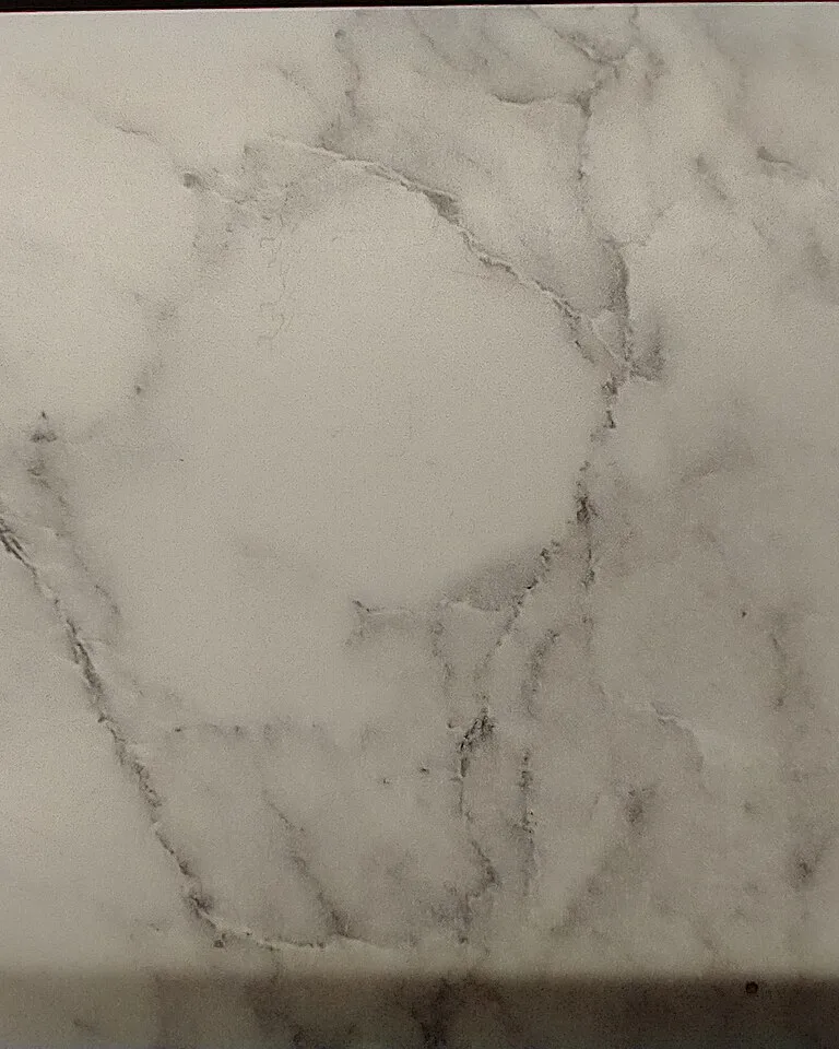 Creamy white marble slab with soft gray veining