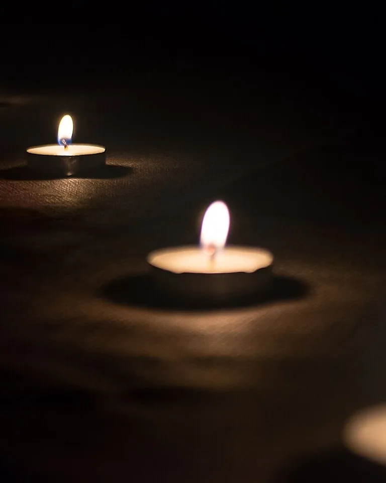 Candles arranged in a bedroom for warm light