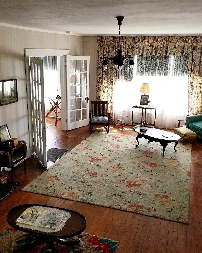 Floral area rug anchoring a traditional living room