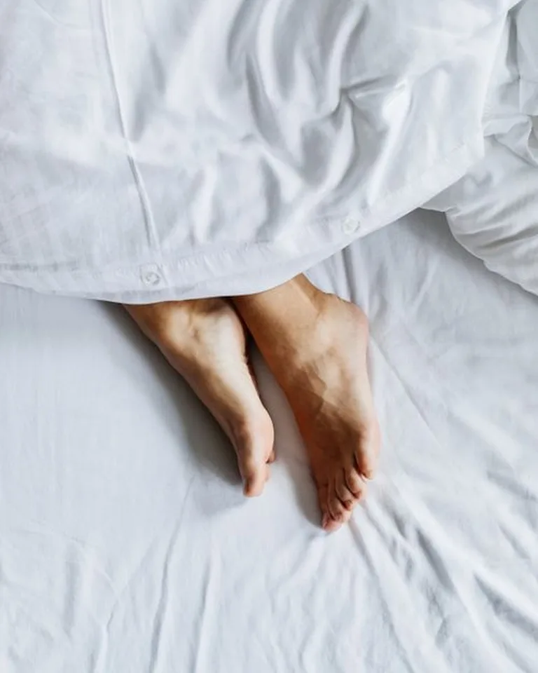 Close-up of soft washed linen duvet cover in ivory tones