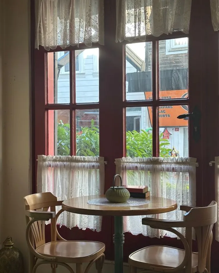 Ruffled café curtains on the lower half of a bedroom window