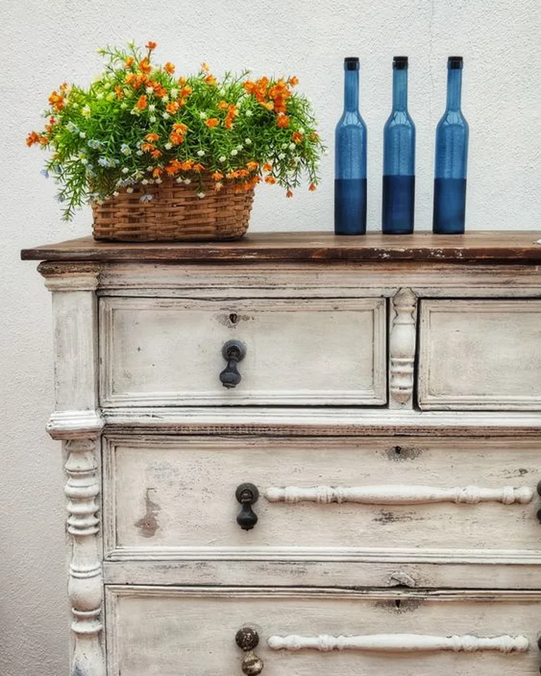Thrifted wooden dresser styled with French country decor