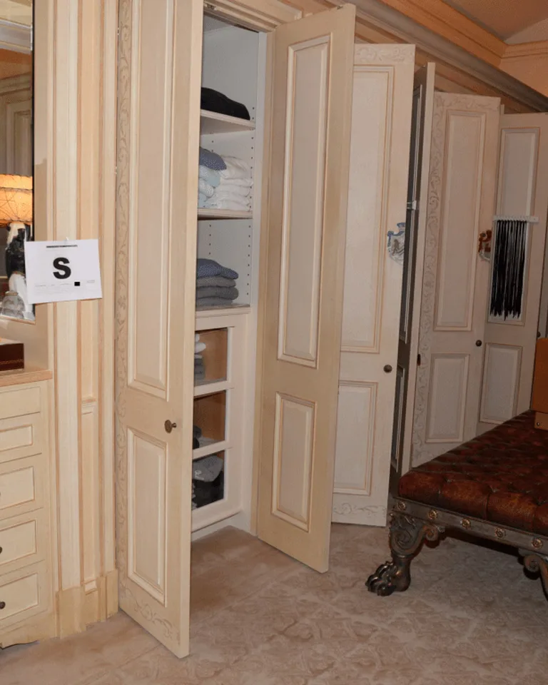 An elegant walk-in closet with a full-length mirror creating a boutique feel