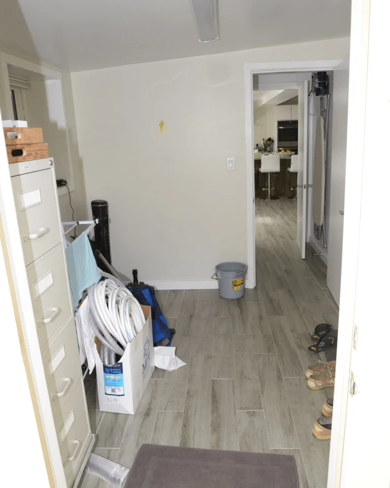A bare hallway entry zone ready to become a garage mudroom drop zone