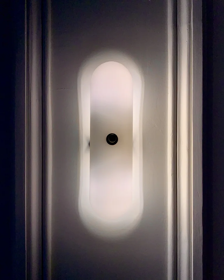 Postmodern wall lamp mounted on an interior wall