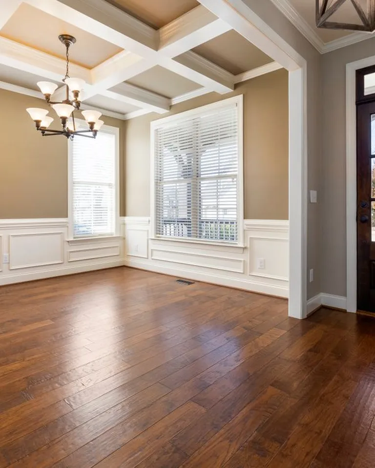 A pendant ceiling light illuminating a hallway entry area