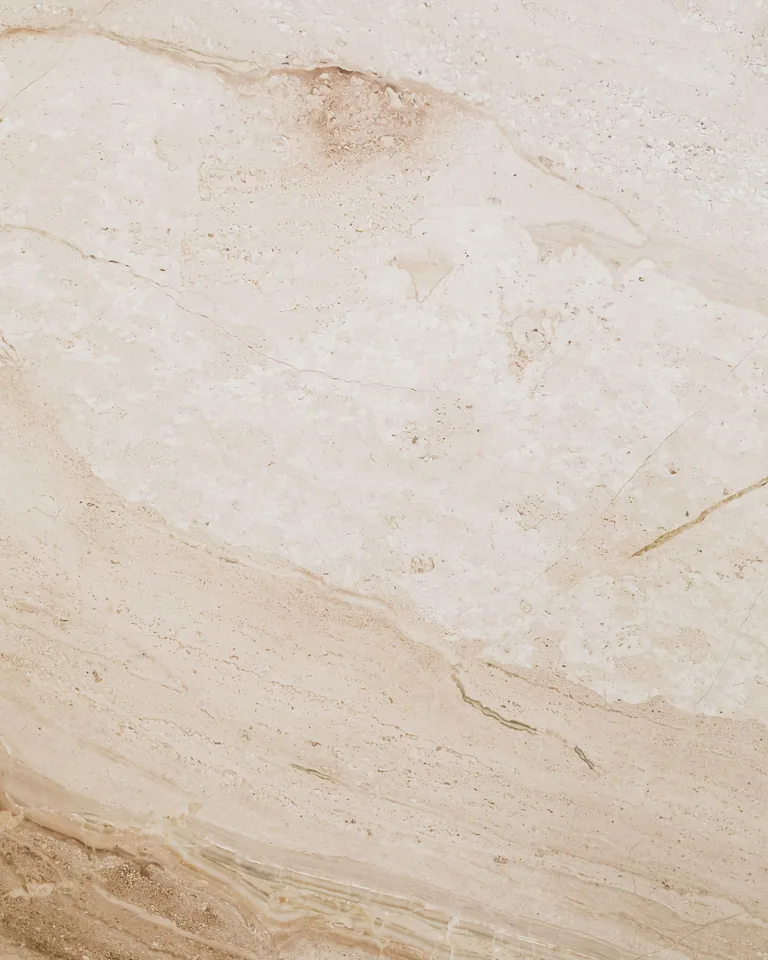 Beige marble-look stone tile surface
