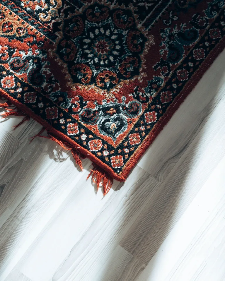 Handmade rug on a wooden floor