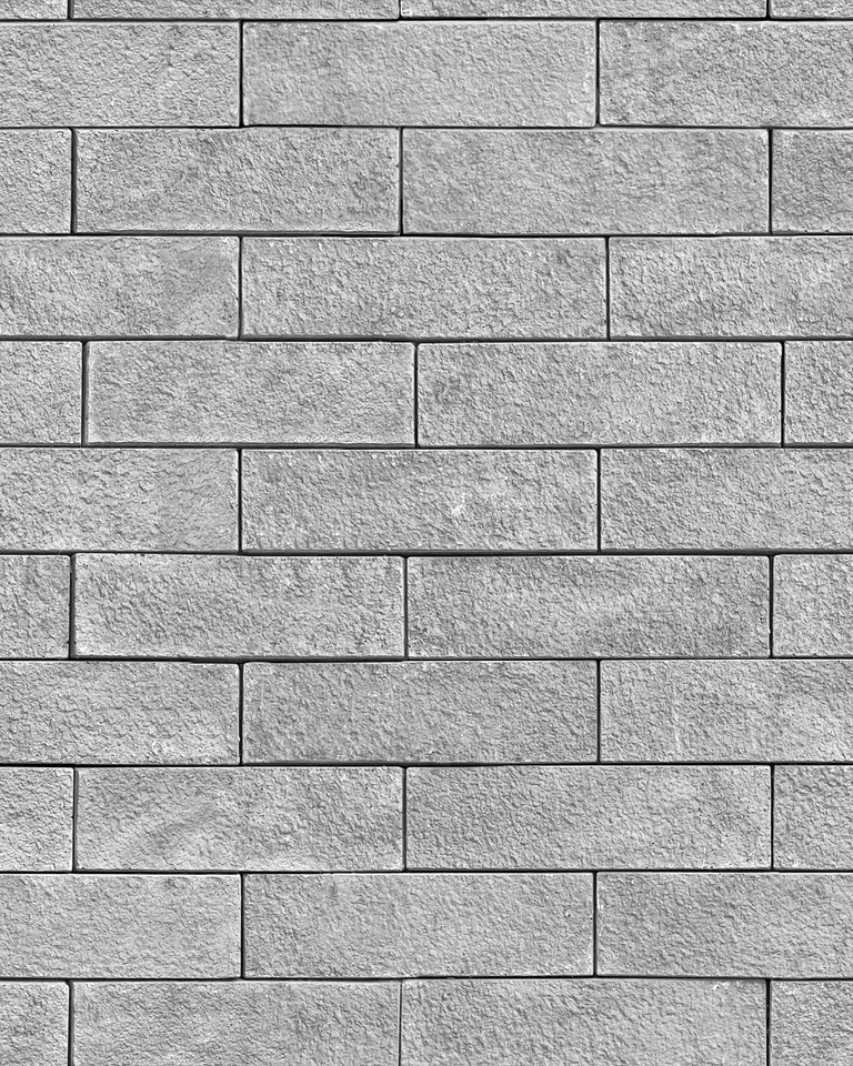 Textured grey stone tile surface