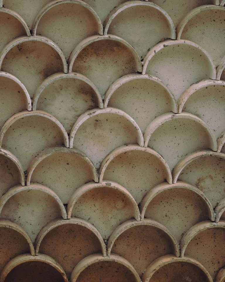 White circular scallop tiles creating a textured pattern