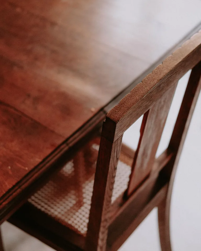 Vintage-style wooden chair and table with minimalist styling