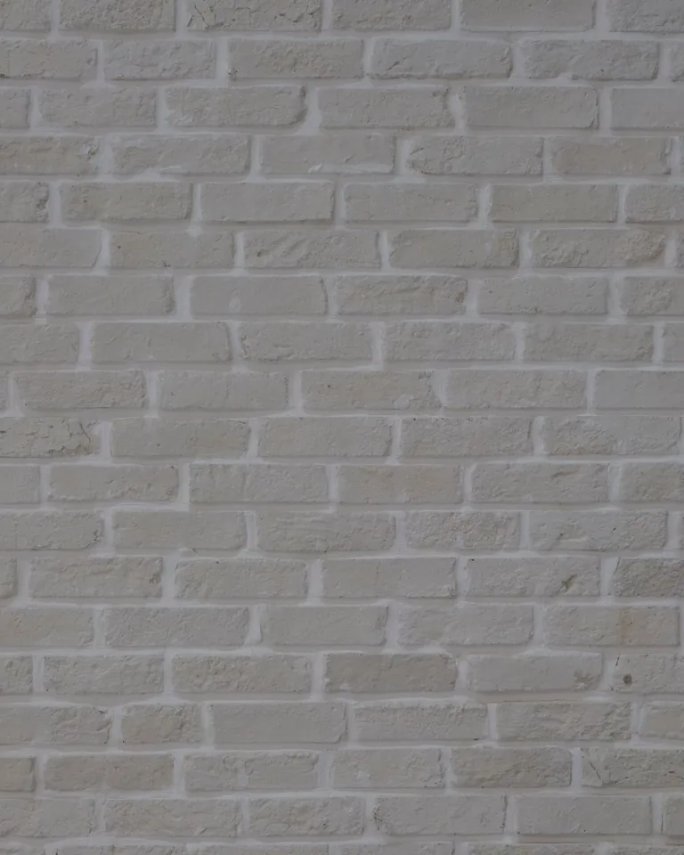 White painted brick wall with natural texture