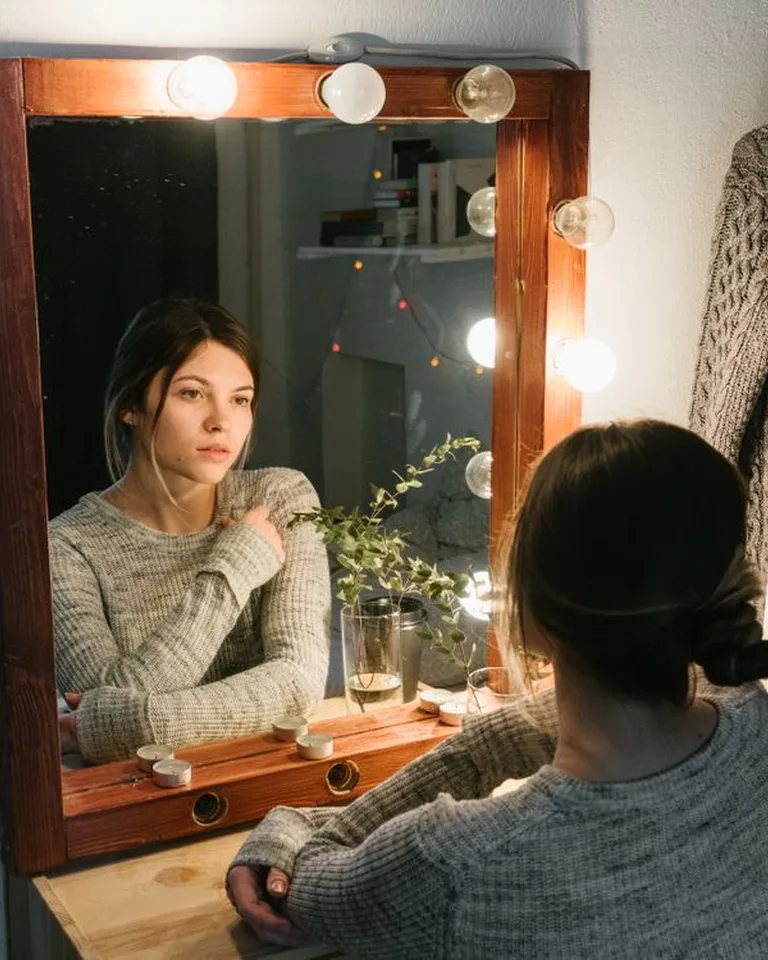 French-style vanity table with a mirror in a bedroom corner