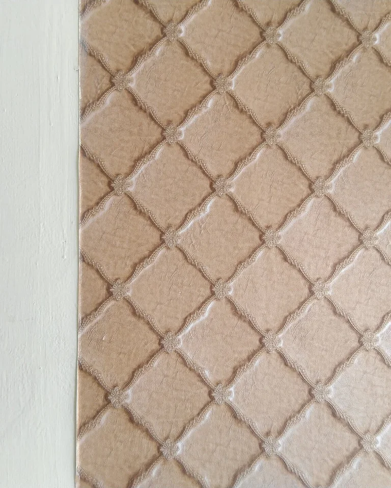 Close-up of diamond-patterned wallcovering