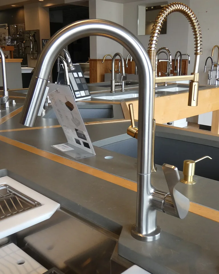Close-up of a modern kitchen faucet with a polished chrome finish