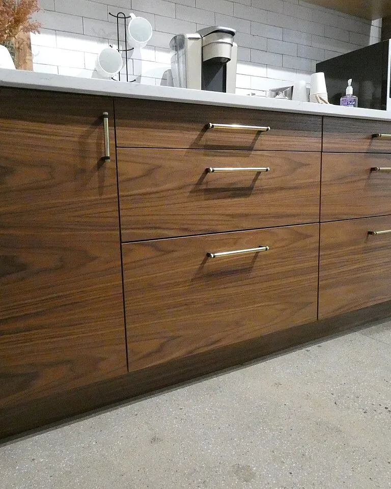 Walnut kitchen cabinet fronts with brass bar pulls