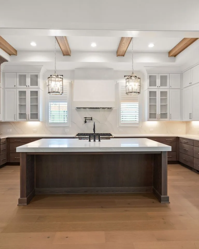 Dark wood kitchen island paired with white painted cabinets
