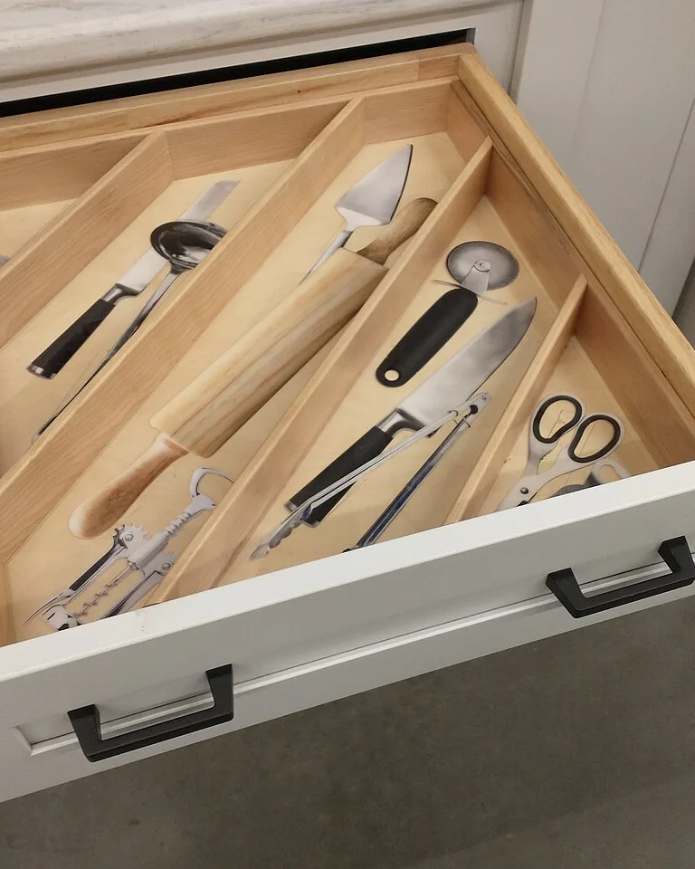 White kitchen cabinets with organized storage