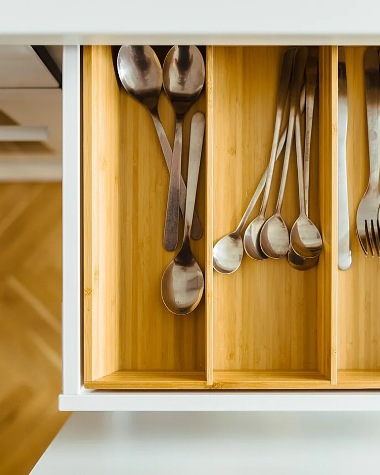 Pull-out organizers inside a kitchen base cabinet