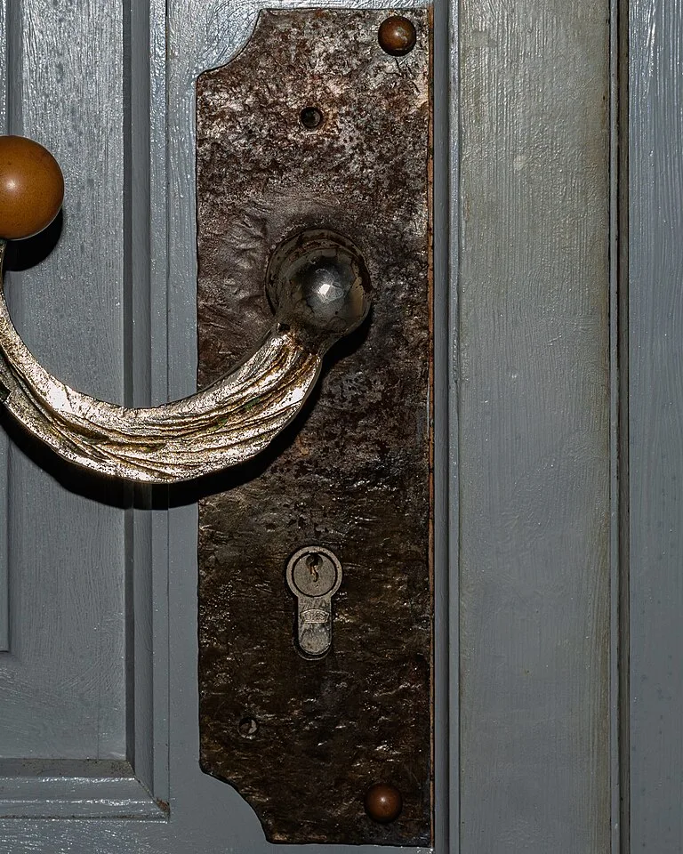 Close-up of brass cabinet pulls on kitchen cabinet doors