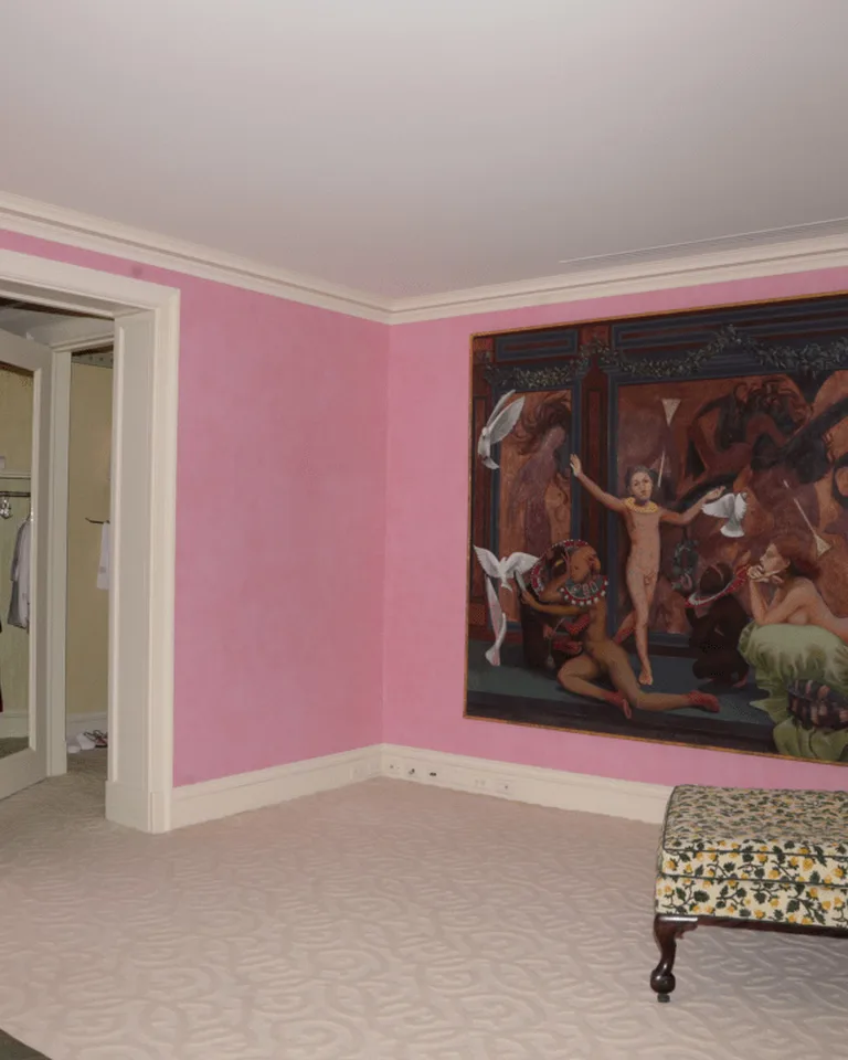 Bedroom with oversized terracotta arch shapes on peel-and-stick wallpaper in a minimalist room