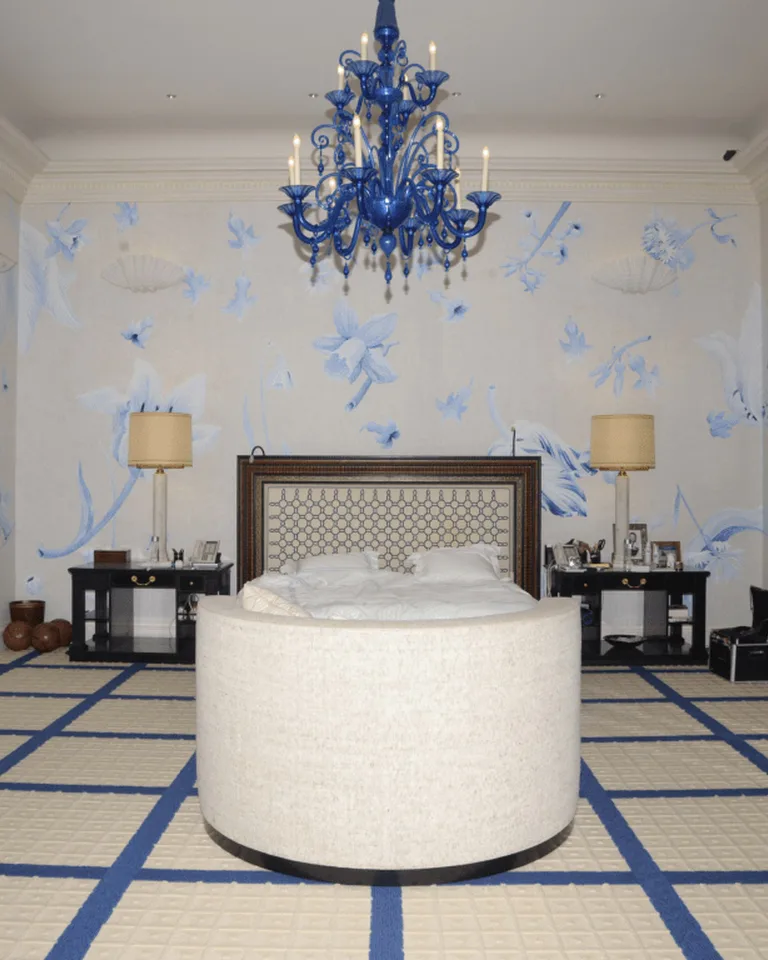 Bedroom with vintage floral damask peel-and-stick wallpaper in muted dusty rose tones