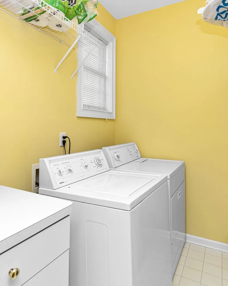 Bright laundry room with supplies organized within reach