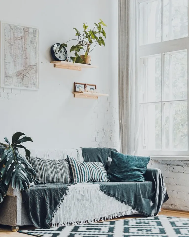 Pair of matching wall sconces flanking a bed headboard