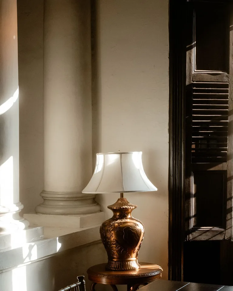 Plug-in pendant lights hanging beside a bed