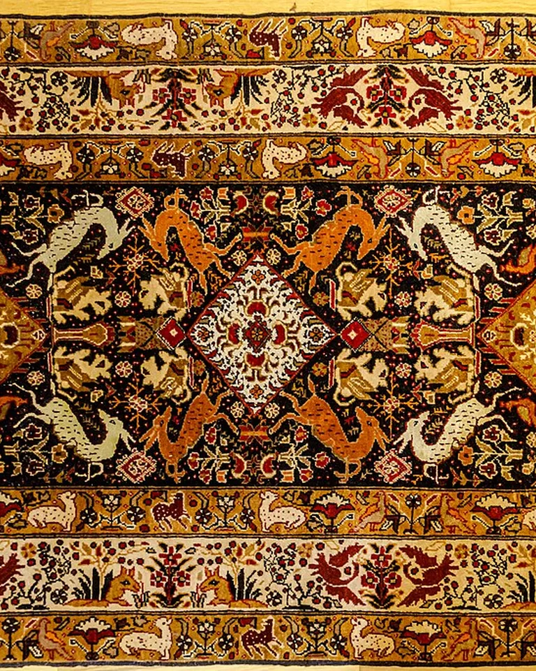 Persian-style carpet with rust, gold, and cream patterns