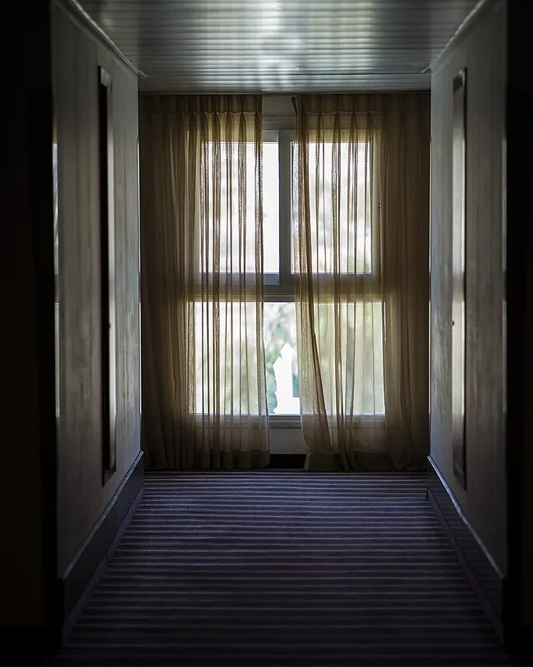 Sheer linen-style curtains on a bright window