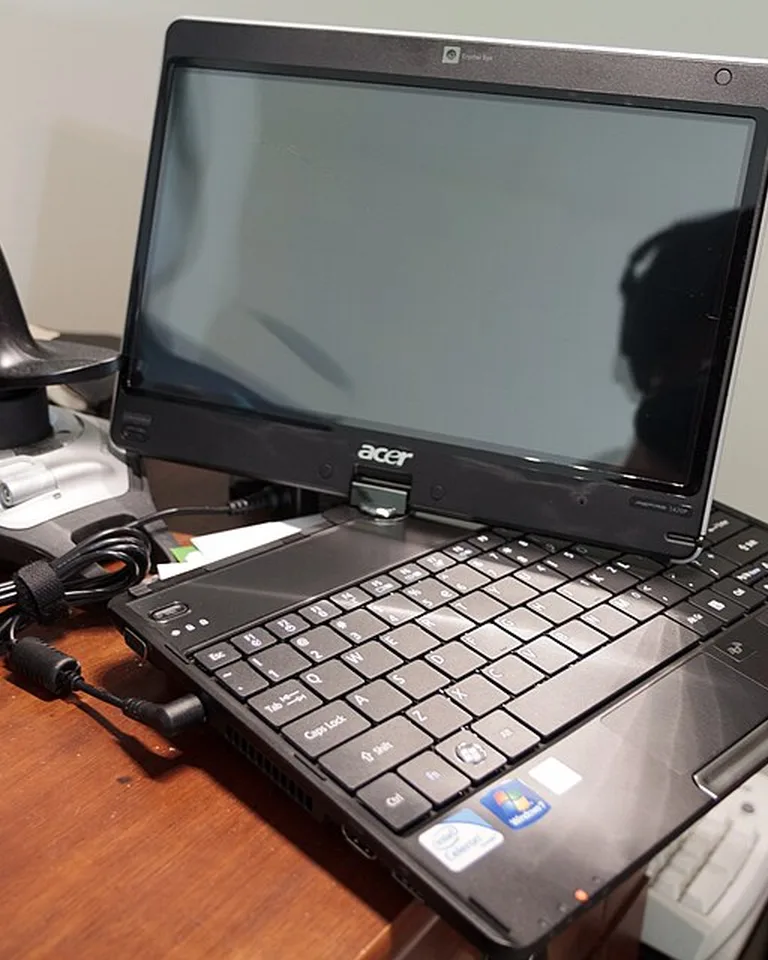 An L-shaped corner desk shared by two people
