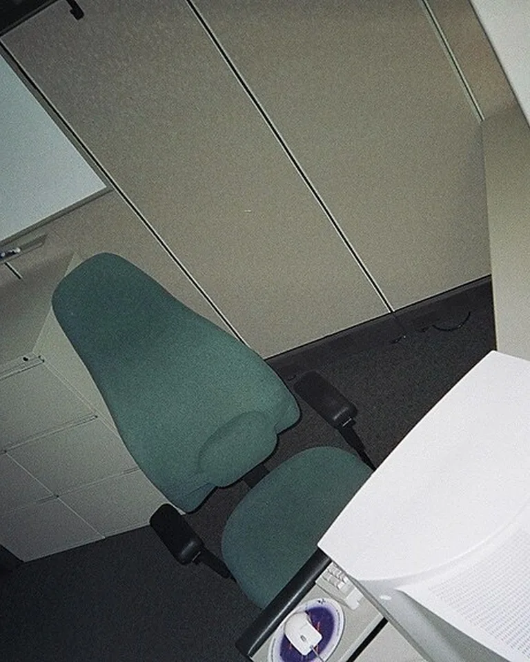 Two office desks placed back to back in a home office