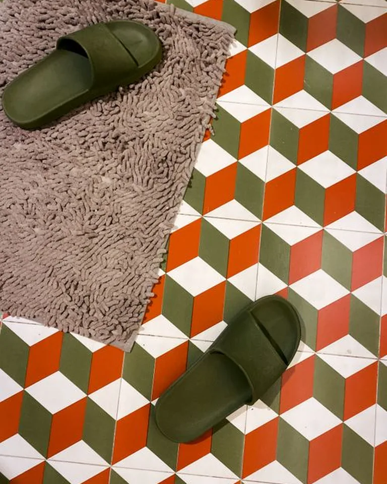Freshly laid vinyl floor tiles in a small bathroom