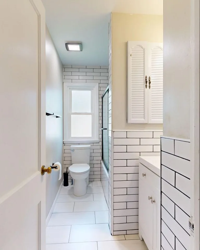 White subway tile bathroom with clean bright grout lines