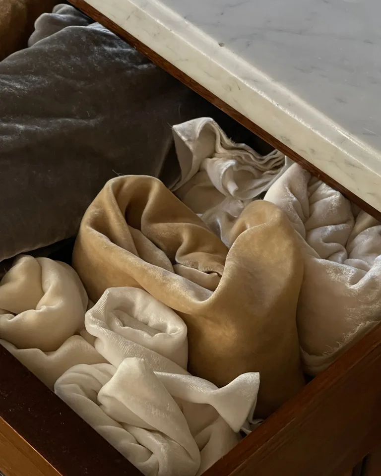 Soft blankets folded and organized inside a drawer