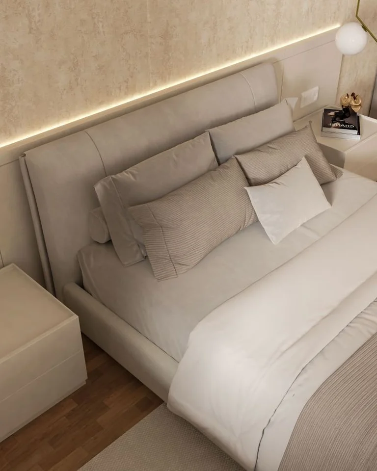 A modern bed with LED strip lighting behind the headboard and hanging pendant lights