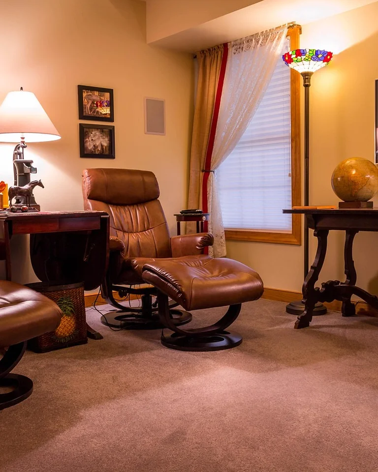 Lounge chairs with ottomans in a cozy living area