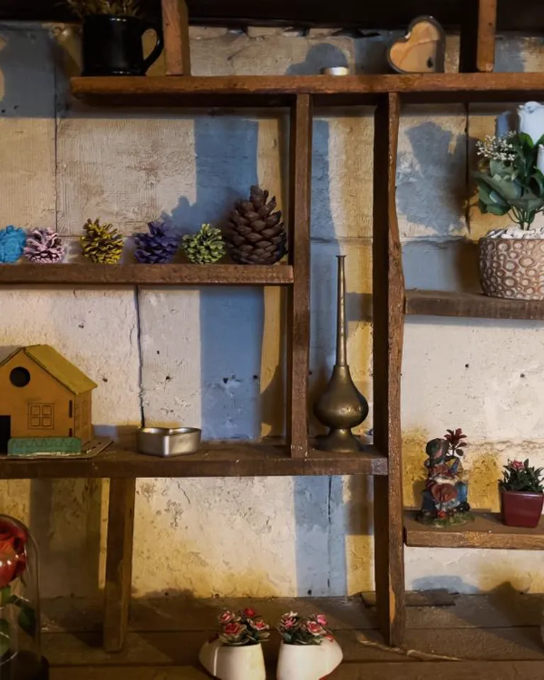 Three decorative objects grouped on a dresser top