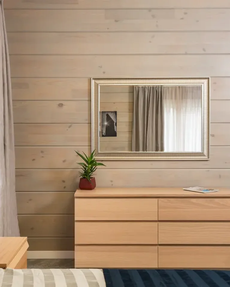 Light wood dresser with drawers in a bedroom