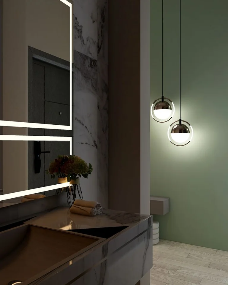 Bathroom with a sage green wall, marble vanity, and modern pendant lights