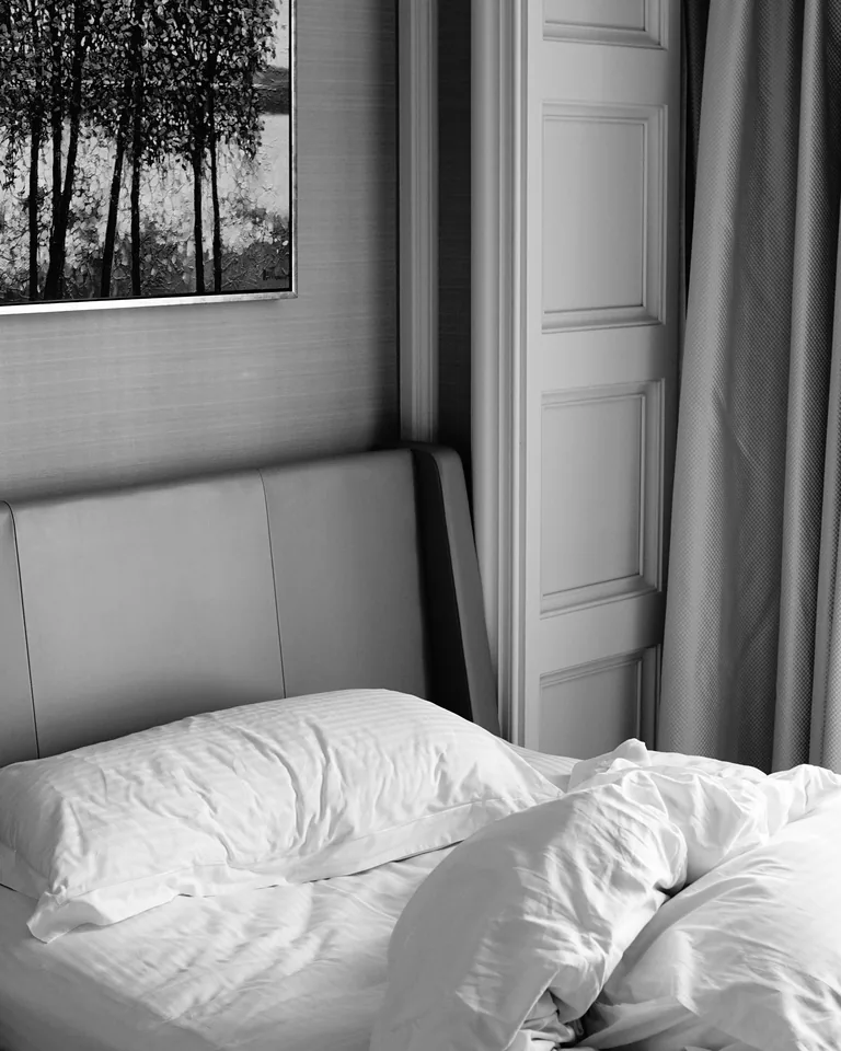 Monochrome bedroom with balanced black and white decor and wall art
