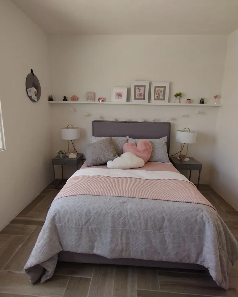 Cozy minimalist bedroom with soft pink accents and bright natural light